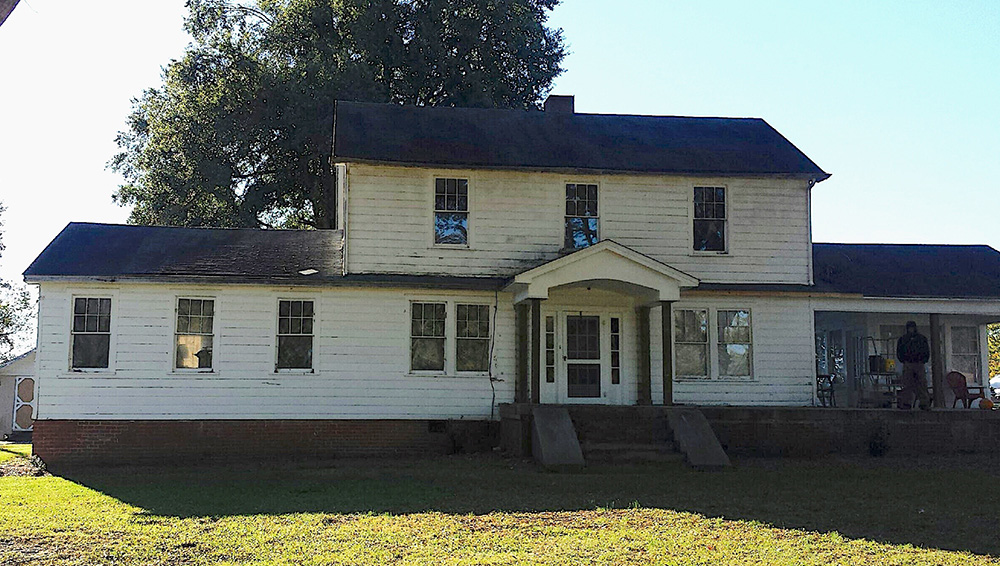 old house needing new windows and siding